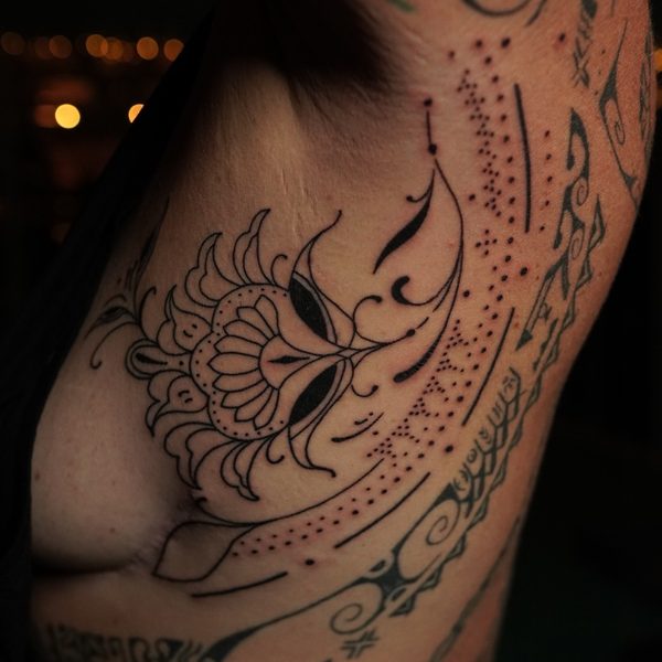 Ornamental lotus and dotwork inner arm tattoo by Jase at Afterglow