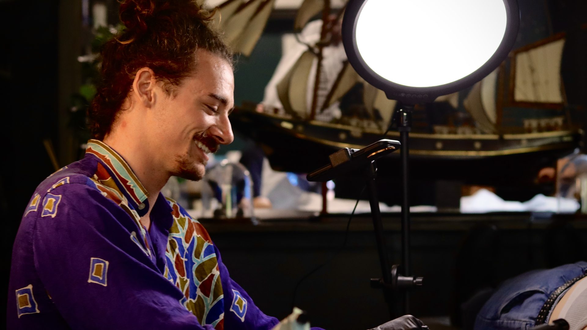 Jase Docia tattooing a client at Afterglow Tattoo Studio on the Sunshine Coast