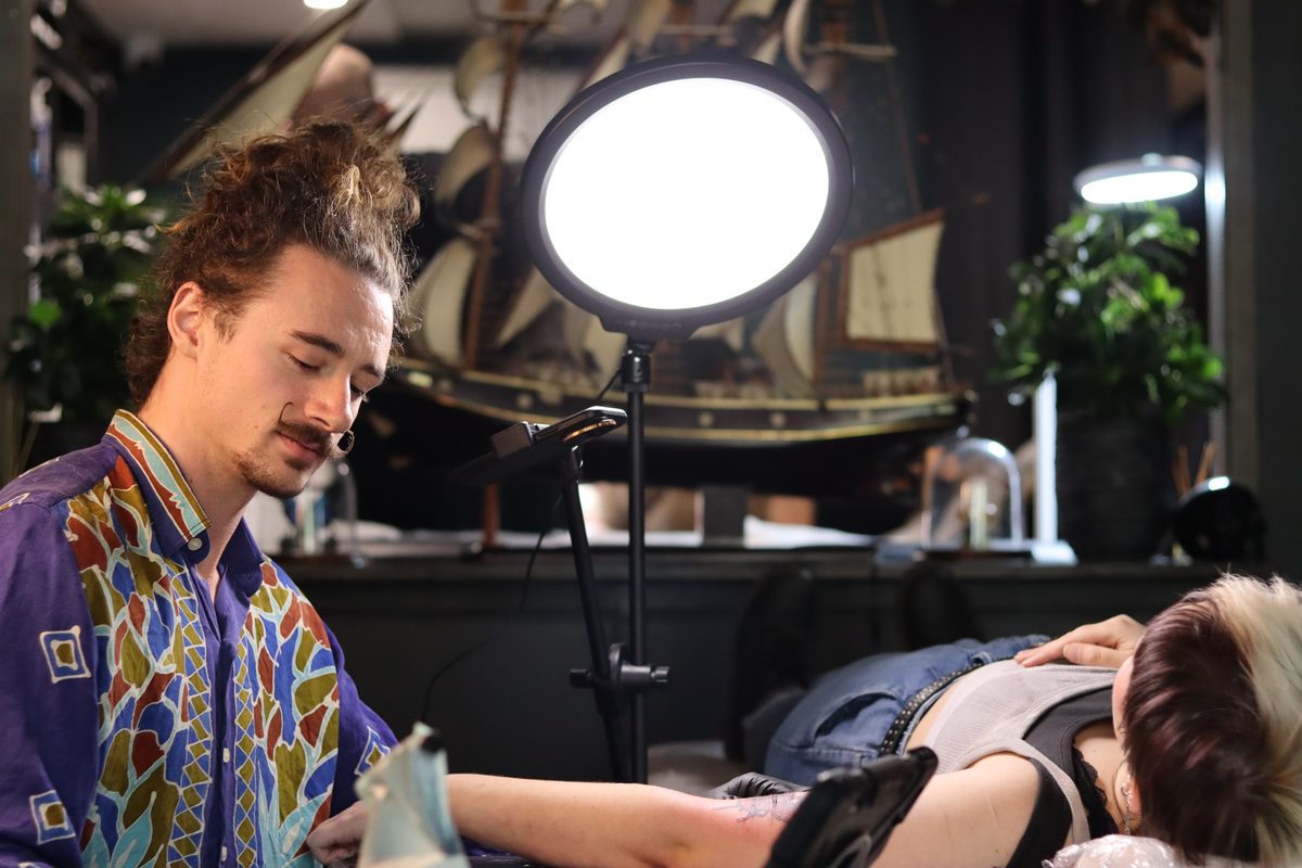 Jase tattooing a client at Afterglow Tattoo Studio, private tattoo studio Sunshine Coast